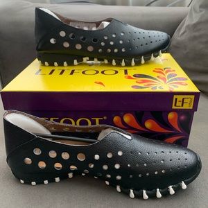 Black and white Litfoot slip in tennis shoes